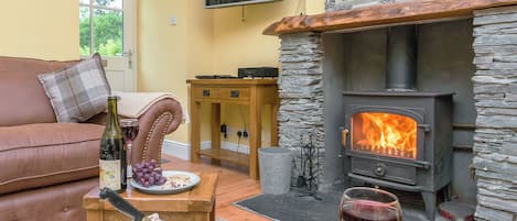 Cosy living room with wood burner | Grace’s Cottage - Invertrossachs Estate Cottages, Invertrossachs, near Callander