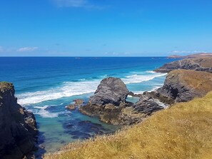 A coastal landscape with rocky cliffs and clear blue sea. - 2 bedroom accommodation in St Merryn, near Padstow (St Merryn, near Padstow)