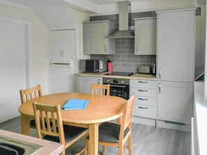 Dishwasher, high chair, cookware/dishes/utensils - 3 bedroom accommodation in Llanddona, near Beaumaris (Llanddona, near Beaumaris)