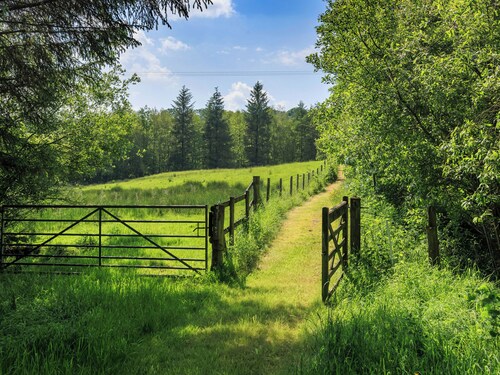 Boasting panoramic views, set in 15 acres, with open water lake and river.