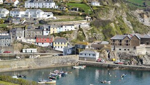 A coastal town with a harbor office, boats, and colorful houses. - 3 bedroom accommodation in Mevagissey (Mevagissey)