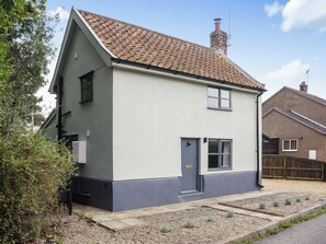 A two-story house with a tiled roof, a chimney, and a small front garden. - 2 bedroom accommodation in Blythburgh, near Southwold (Blythburgh, near Southwold)