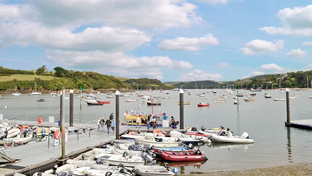 A marina with various boats docked, a pier, and a grassy hill in the background. - 2 bedroom accommodation in East Charleton, near Kingsbridge (East Charleton, near Kingsbridge)