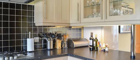 Dishwasher, high chair, cookware/dishes/utensils