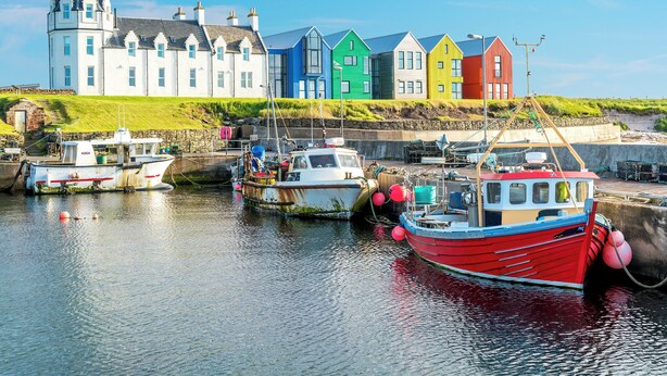 A harbor with colorful houses and boats.