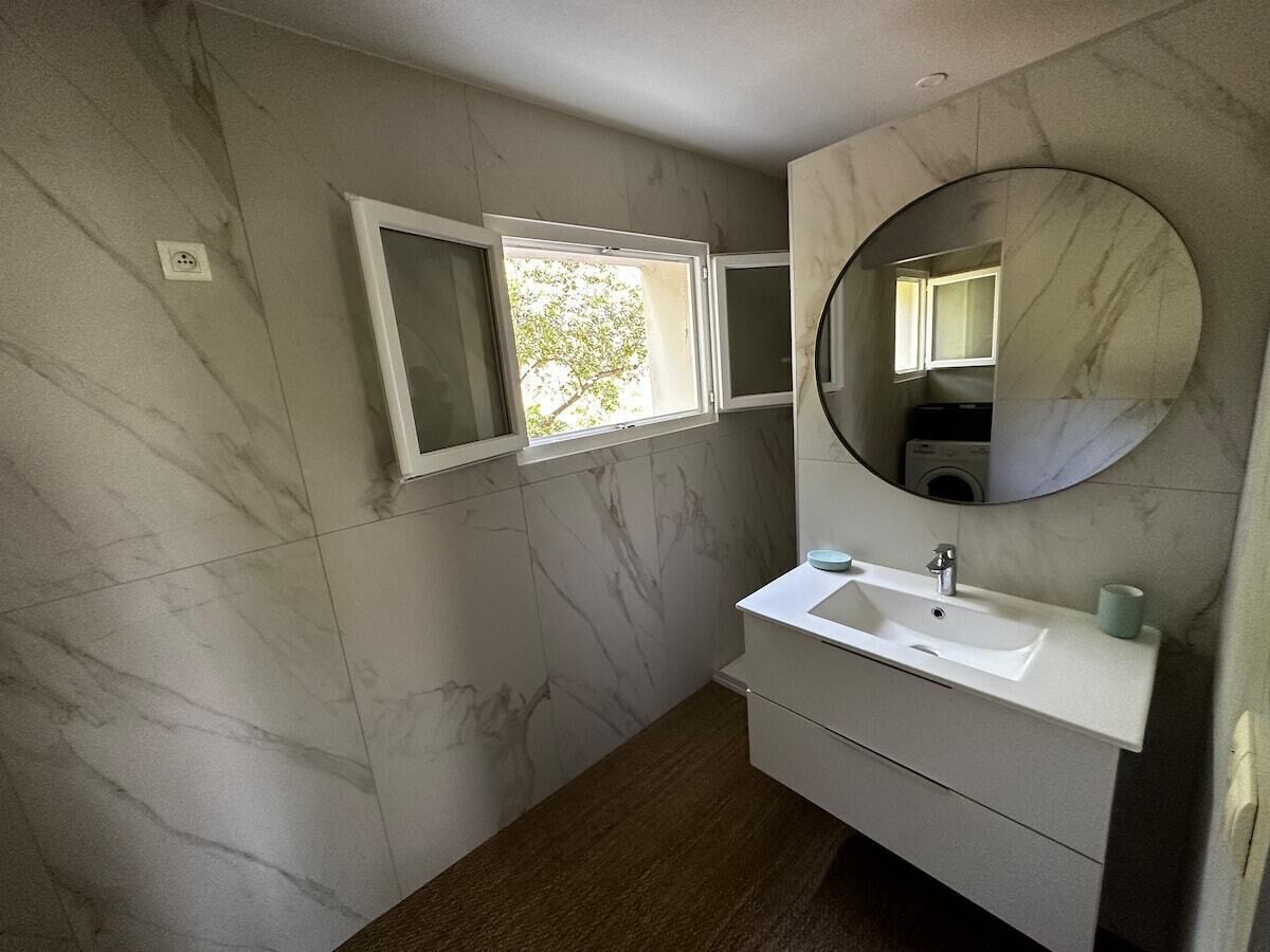 Shower, hair dryer, towels, toilet paper