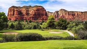 A golf course with a clear view of red rock formations in the background. - UPSCALE Sedona VIEWS-heated POOL-golf-hot tub-Pball-tennis-fireplace-PRIVATE (Sedona)