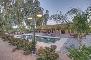 A pool area with lounge chairs, a pergola, and a building in the background. - STARFIRE Golf VIEW, Pvt POOL w/opt Heat, Putting Green, Fire Pit, 10 mins to Old Town (Scottsdale)