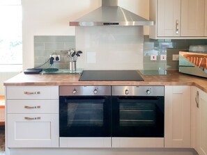 Dishwasher, high chair, cookware/dishes/utensils - 5 bedroom accommodation in Llanfaethlu, Anglesey (Llanfaethlu, Anglesey)