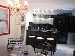 Enjoy cooking in this well-equipped kitchen with a central island and bar stools.