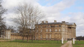 A large, historic building with a symmetrical facade, large windows, and a central entrance. - 6 bedroom accommodation in Attingham Park, near Shrewsbury (Attingham Park, near Shrewsbury)
