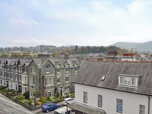 A row of terraced houses with stone facades and pitched roofs, typical of a historic urban area.