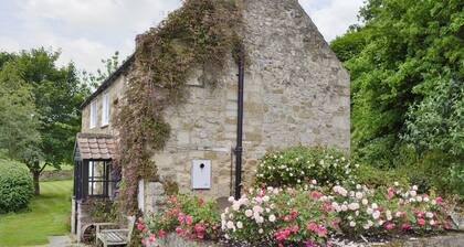 A detached character cottage with an open fire, overlooking Rievaulx Abbey.