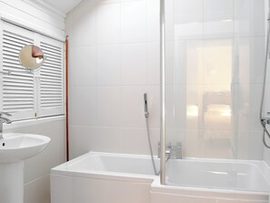 A modern bathroom with a bathtub, a sink, and a shower enclosure. - 2 bedroom accommodation in near Kilgetty (near Kilgetty)