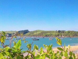 A coastal view with boats, greenery, and hills. - 3 bedroom accommodation in East Prawle (East Prawle)