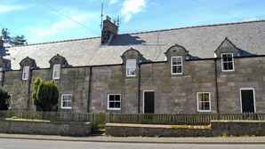 A stone building with multiple windows and a tiled roof. - 2 bedroom accommodation in Belford, near Alnwick (Belford, near Alnwick)