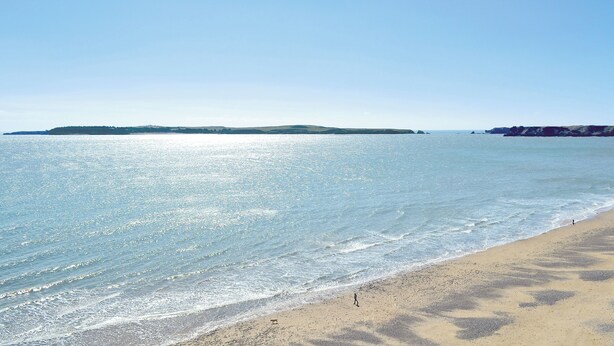 A beach with clear water and a distant landmass. - 3 bedroom accommodation in New Moat, near Narberth (New Moat, near Narberth)