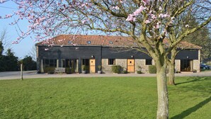 A building with a tiled roof, a front porch, and a tree in front. - 4 bedroom accommodation in Uggeshall, near Southwold (Uggeshall, near Southwold)