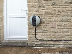 A brick wall with a door and a padlock on it. - 5 bedroom accommodation in Bakewell (Bakewell)