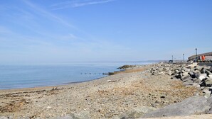 A rocky beach with a clear sky. - 2 bedroom accommodation in Cilcennin, near Aberaeron (Cilcennin, near Aberaeron)