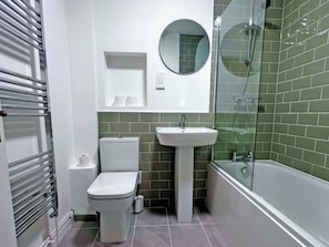 A bathroom with a toilet, sink, and shower. - 2 bedroom accommodation in Keswick (Keswick)