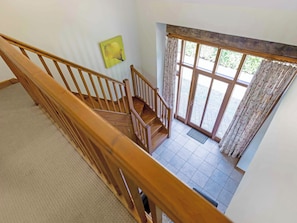 A wooden staircase leading to a balcony with a view of the outdoors. - 2 bedroom accommodation in Catfield (Catfield)