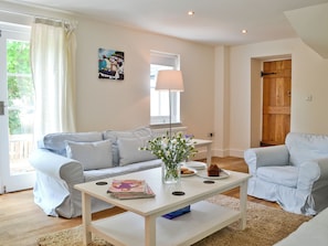 TV, fireplace - A detached character cottage with beams, wood burner and enclosed garden. (Nanternis near New Quay)