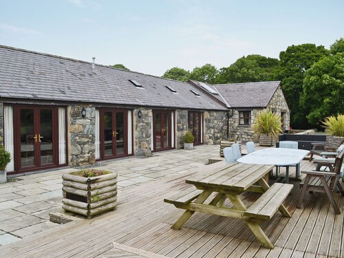 Spacious barn conversion with a riverside location.