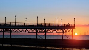 A pier extending into the water with street lamps and benches. - 2 bedroom accommodation in West Ashby, near Horncastle (West Ashby, near Horncastle)