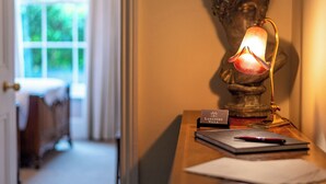A desk with a lamp, a nameplate reading "Langford Villa," and a notebook. - 3 bedroom accommodation in Filey (Filey)