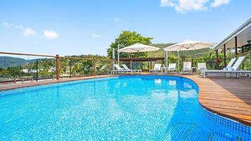 Outdoor pool, open 7:00 AM to 7:00 PM, pool umbrellas, sun loungers