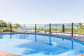 Outdoor pool, open 7:00 AM to 7:00 PM, pool umbrellas, pool loungers