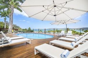 Outdoor pool, open 7:00 AM to 7:00 PM, pool umbrellas, sun loungers