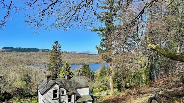 A house with a sloped roof, a chimney, and a small porch with outdoor seating. - 3 bedroom accommodation in Beech Hill, near Bowness-on-Windermere (Beech Hill, near Bowness-on-Windermere)