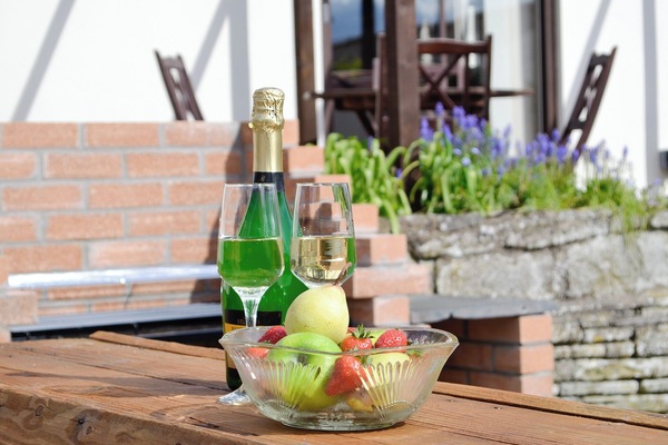 Outdoor seating on the gravelled patio | Three Views Bungalow, Talgarth, near Hay-on-Wye