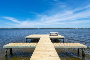 Stroll along the pier and enjoy a peaceful meal at the picnic table overlooking the calm waters.