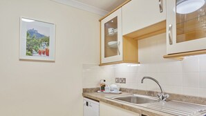 Dishwasher, high chair, cookware/dishes/utensils - 1 bedroom accommodation in Marazion (Marazion)