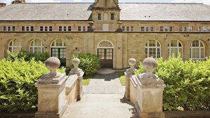 A historic building with a symmetrical facade, arched windows, and a central entrance. - 2 bedroom accommodation in Tehidy Park, near Camborne (Tehidy Park, near Camborne)