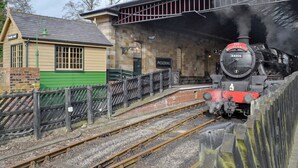 A vintage train station with a steam locomotive, a waiting platform, and a small building labeled "Pickering." - 3 bedroom accommodation in Pickering (Pickering)