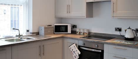 Dishwasher, high chair, cookware/dishes/utensils