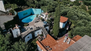 An aerial view of a property with a swimming pool, outdoor seating, and a garden area. - VillaBiancaSorrento-Sea View-Private Pool-Heated Jacuzzi-Gym-Private Car Park (Sorrento)