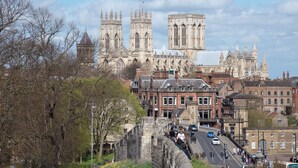 A historic cathedral with twin towers and a large central building, surrounded by traditional stone buildings and a stone bridge. - 2 bedroom accommodation in Kennythorpe near Malton (Kennythorpe near Malton)