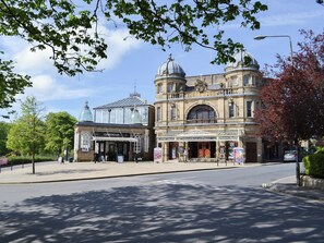 A historic opera house with a classical facade, large windows, and a prominent dome. - The Old School House (Tideswell)