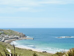 A coastal town with a beach, rocky cliffs, and a clear view of the ocean. - 2 bedroom accommodation in Tregeseal, near St Just (Tregeseal, near St Just)