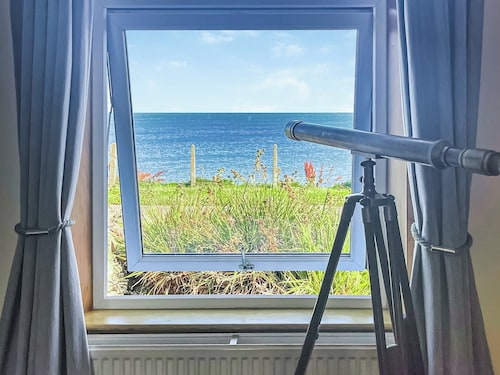 Delightful cottage overlooking Luce Bay, with open fire and enclosed garden.