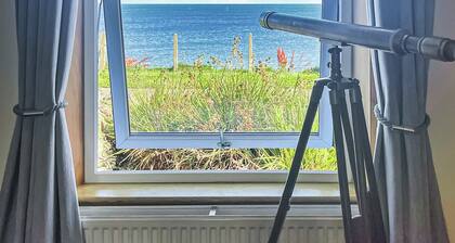 Delightful cottage overlooking Luce Bay, with open fire and enclosed garden.