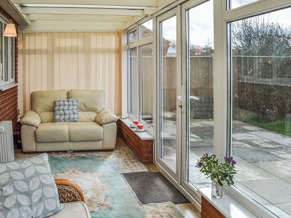 TV, fireplace - 3 bedroom accommodation in Walcott, near North Walsham (Walcott, near North Walsham)