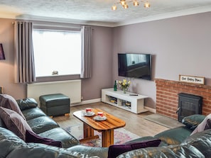 TV, fireplace - 3 bedroom accommodation in Walcott, near North Walsham (Walcott, near North Walsham)