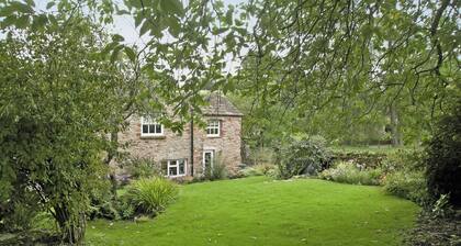 A spacious detached cottage located by a beck in a quiet village.