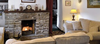 Ground Floor:
Living room: TV, Freesat, Open Fire
Dining room.